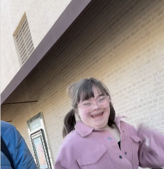 girl with down syndrome (ruby's rainbow) smiling with excitement